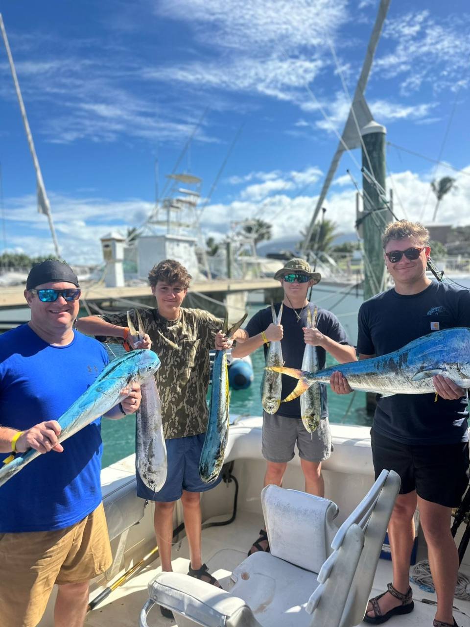 Four guests display several mahi after a High Z's fishing trip at Ocean World Marina